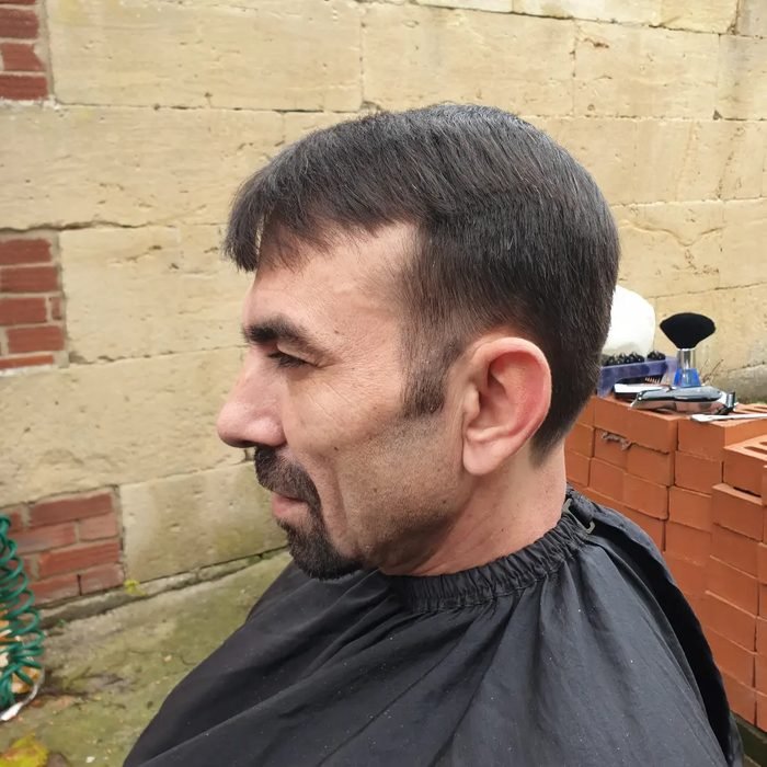 Client wearing barber cape