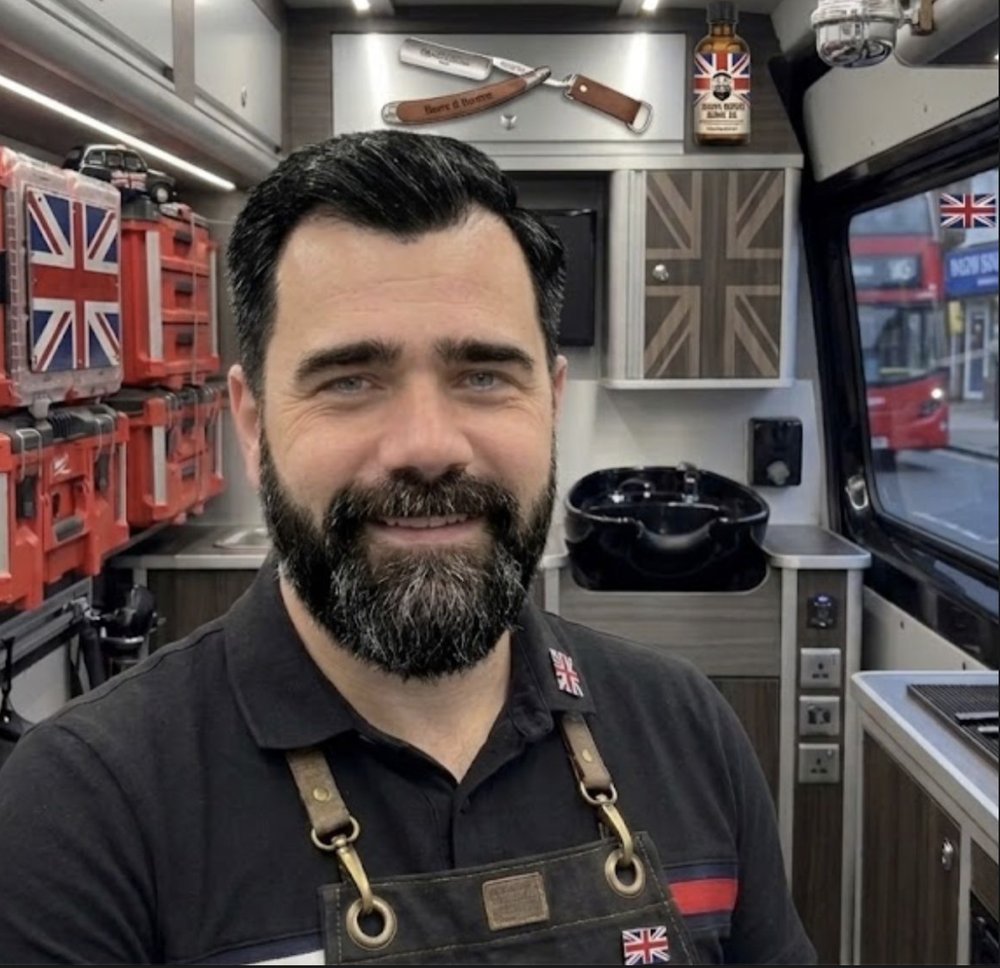 Pasha, mobile barber, inside his fitted-out van